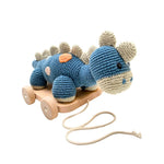 Load image into Gallery viewer, Crochet 2 in 1 Pull along toy dinosaur steggi Petrol blue
