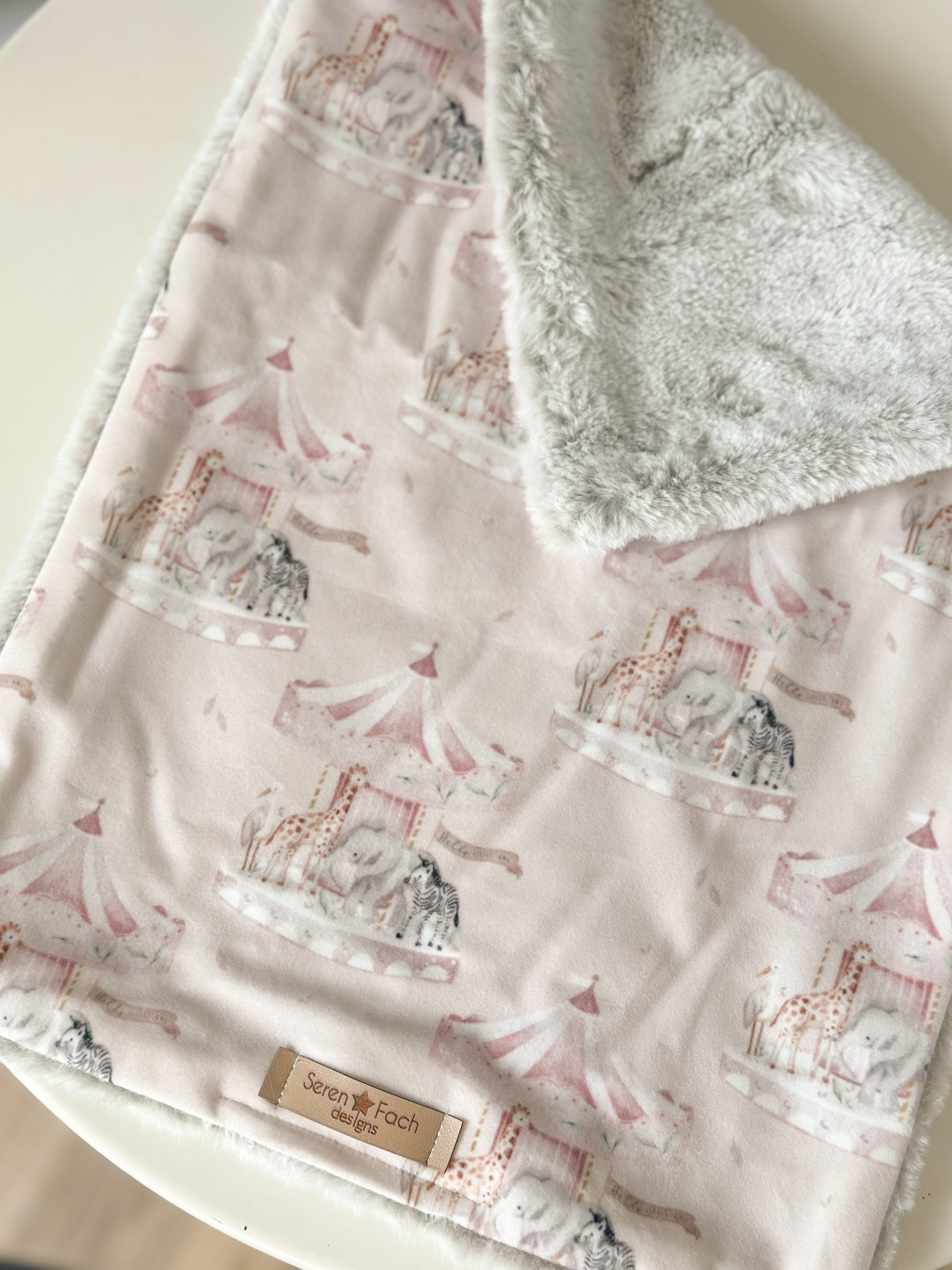 Pink carousel cuddle comforter