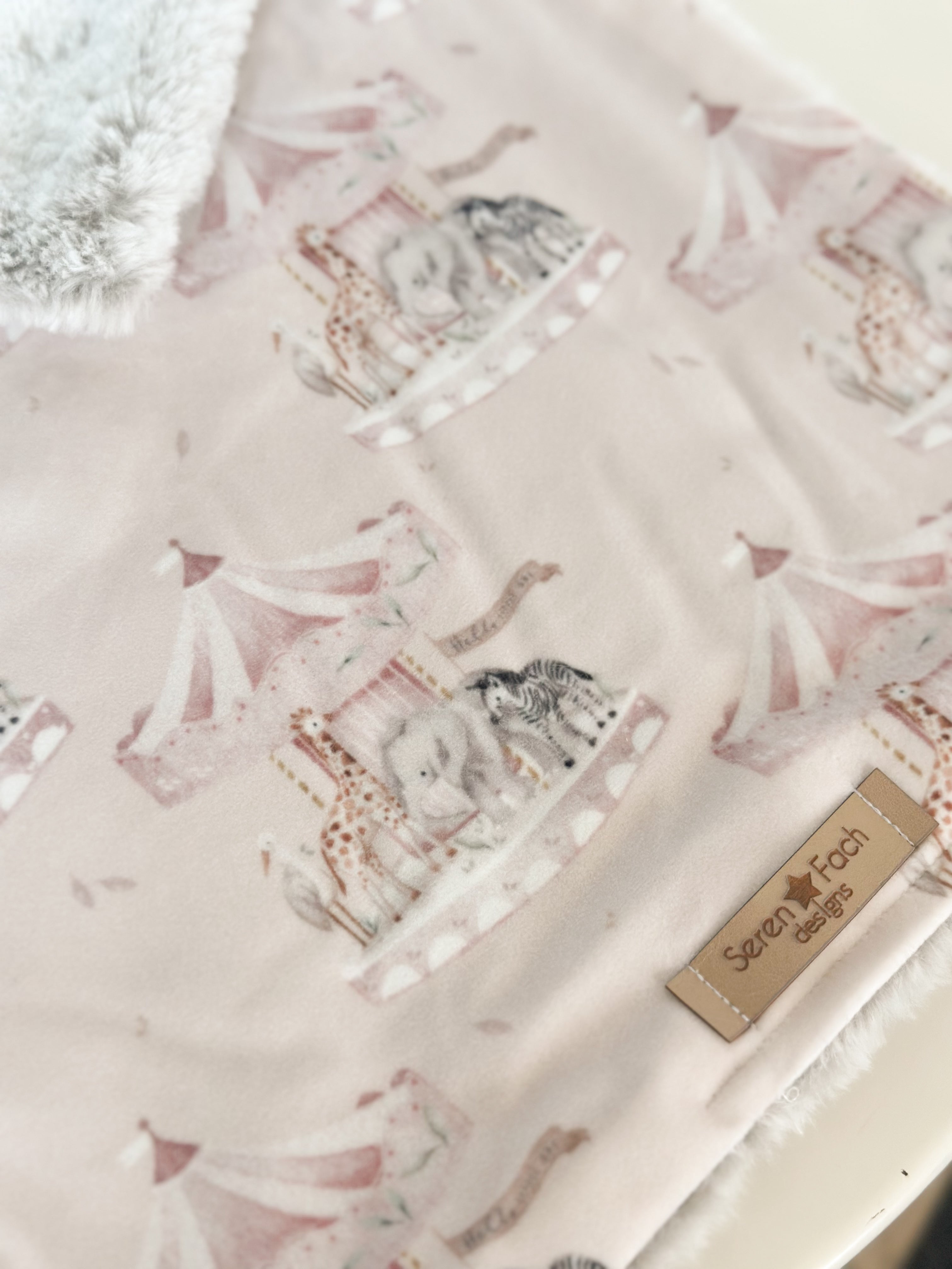 Pink carousel cuddle comforter